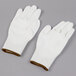 A pair of white Cordova Javelin gloves with brown trim on the wrist.