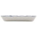 A white rectangular melamine tray with a scalloped edge and blue details.