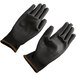 A pair of large black Cordova Monarch work gloves with black polyurethane palms.