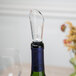 A wine bottle with a Franmara air-flow wine pourer and aerator on top.