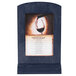 A denim framed wood menu tent with angled base on a table with a menu showing a glass of wine.