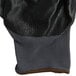 A close up of a gray Cordova warehouse glove with black nitrile palm coating.