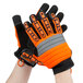 A pair of large Cordova Colossus orange and black warehouse gloves.
