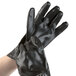 A pair of black Cordova PVC sandpaper gloves with jersey lining.