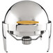 A silver round chafer cover with gold trim and a round yellow handle.