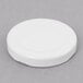 A white circular plastic lid with a white background.