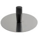 A Matfer Bourgeat stainless steel circular mold pack down tool with a black handle.
