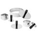 A group of Matfer stainless steel ring molds with black handles.