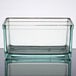 A clear rectangular glass container with a lid.