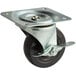 A True 4" swivel plate caster with a metal and black wheel.