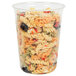A Fabri-Kal clear plastic deli container filled with pasta salad.
