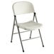 A white Lancaster Table & Seating folding chair with a curved seat and metal legs.