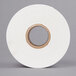 A roll of white thermal labels with a white background.