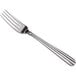An Acopa Harmony stainless steel table fork with a silver handle.