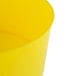 A yellow plastic Choice beverage dispenser base with a lid.