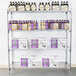 A Metro stationary wire shelving unit with boxes and bottles on the shelves.