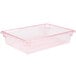A clear polycarbonate food storage box with red trim.