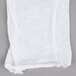A pair of white Cordova Lisle gloves on a white cloth.