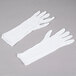 A pair of white Cordova Lightweight Cotton gloves.
