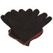 A pair of brown jersey gloves with red lining.