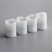 A group of three white Sterno rechargeable flameless votive candles.