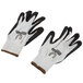 A pair of large white Cordova Commander gloves with black foam nitrile coating on the palms.