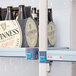 A MetroMax Q shelving unit with Guinness beer bottles on a shelf.
