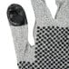 A close-up of a pair of Cordova Monarch gloves with black dots on them.