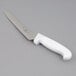 A Choice bread knife with a white handle.