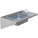 A Crown Verity stainless steel hand sink with a faucet and drain.