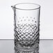 A Libbey cocktail stirring glass with a diamond pattern on it and a handle.