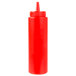 A close-up of a red plastic Choice squeeze bottle with a lid.