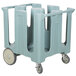 A blue plastic Cambro dish cart with wheels for 4 columns of dishes.