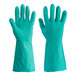 A pair of green Cordova nitrile gloves on a white background.
