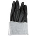 A pair of black Cordova sandpaper gloves with a white lining.