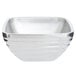 A silver stainless steel Vollrath double wall square bowl.