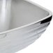A Vollrath stainless steel double wall square serving bowl.