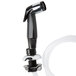 A black and silver T&S deck-mounted workboard faucet with a hose.