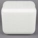 A white foam cube with a lid on it.