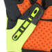 A close up of a pair of Cordova heavy duty work gloves with lime green spandex and orange synthetic leather.