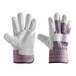 A pair of white Cordova canvas work gloves with blue and red stripes on the cuffs.