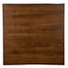 A brown square wooden surface on a Lancaster Table & Seating dining table.