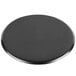 A black circular Matfer Bourgeat carbon steel pizza pan.