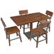 A Lancaster Table & Seating live edge wooden dining table with four wooden chairs.