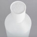 A white plastic Matfer Bourgeat squeeze bottle with a white perforated cap.
