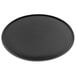 A black round Matfer Bourgeat carbon steel oven sheet with a round bottom.
