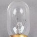 A Satco clear incandescent indicator light bulb with a gold base and wires.
