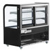 An Avantco black and silver dry bakery display case with curved glass on wheels.