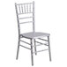 A silver Flash Furniture Hercules Chiavari stacking chair with a wooden seat.
