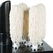A Campus Products polishing head kit with white mop heads on a black stand.